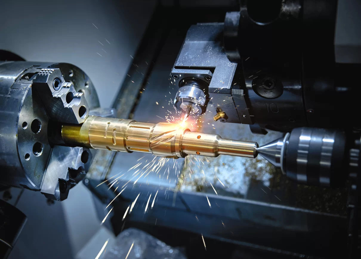 Close-up of a CNC machine cutting a brass component, sparks flying in a precision manufacturing environment.