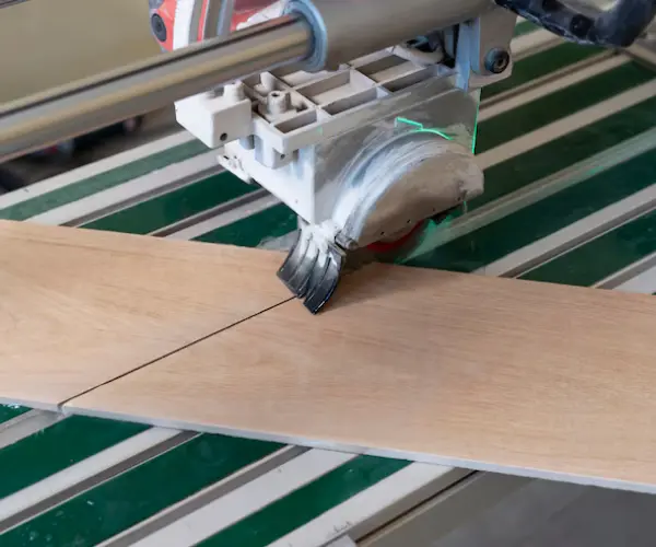 CNC routing blade cutting wood panel with high precision on automated machine table
