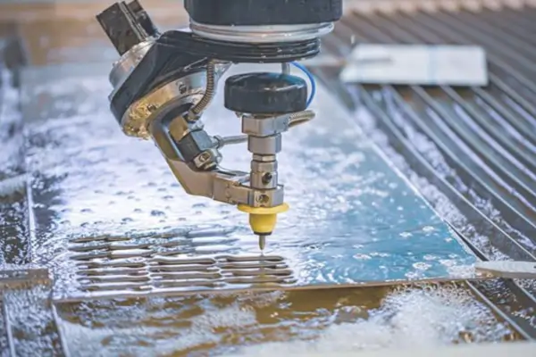 A waterjet machine precisely cutting a metal sheet, creating an as-cut surface finish.